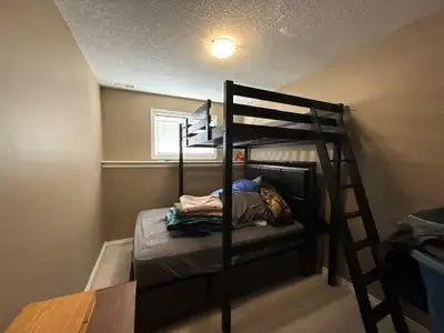 Wooden loft bed, must pick up $50.00, can take thin mattress also. Height - 84" bunk height - 71" Wi...