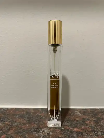 Yum Pistachio Gelato perfume travel spray by Kayali. A little over half full. Retails at Sephora for...