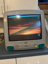Apple iMac G3 vintage computer with mouse and keyboard
