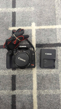 Canon EOS Rebel XS DS126191 Digital Camera w/ strap and lens