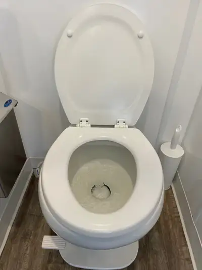 Qty 5 Rv Toilets with spray attachment and water line. Some extra replacement parts. Slow close lid,...