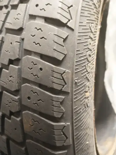 Four Winter Tires on Rim, 5 x 4 and half inch alternative holes of 215/60/R16, off Nissan. with a lo...