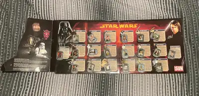 Collection of Star Wars character pins. Features characters like Darth Vader, Luke Skywalker, and Yo...