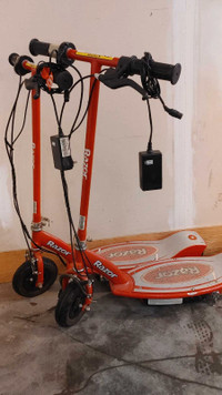 Pair of Razor E100 Electric Scooters