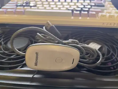 This is the official Microsoft Wireless Gaming Receiver, not a third‑party clone. It allows you to u...