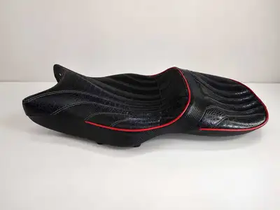Premium Corbin dual canyon motorcycle seat is constructed with black alligator-textured leather and...