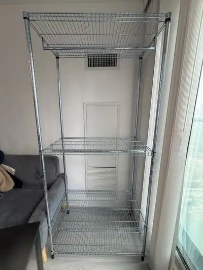 This used IKEA OMAR shelving unit with clothes rail is galvanized and measures 92x50x201 cm (36 1/4x...