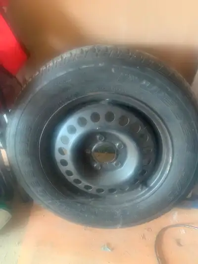Bridgestone Dueler tire on Chevrolet rim Originally from a Chevrolet venture van Over 50% thread no...