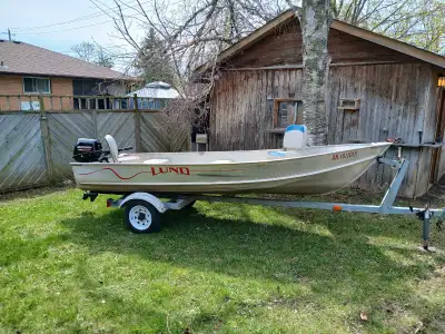 14 ft Lund aluminum boat. Very solid all aluminum boat with a good solid transom. Motor is a newer 2...