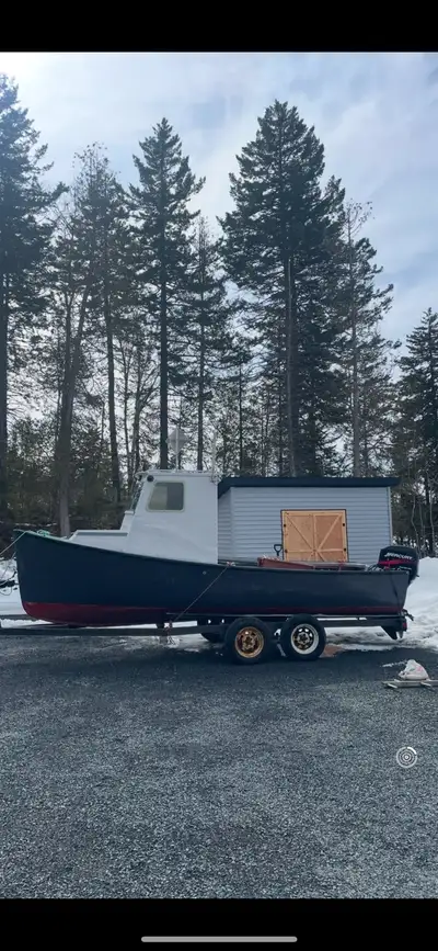 Skiff with wheels house. 50 hp merc big foot Dual axle trailer 3 bilges under floor VHF Control pane...