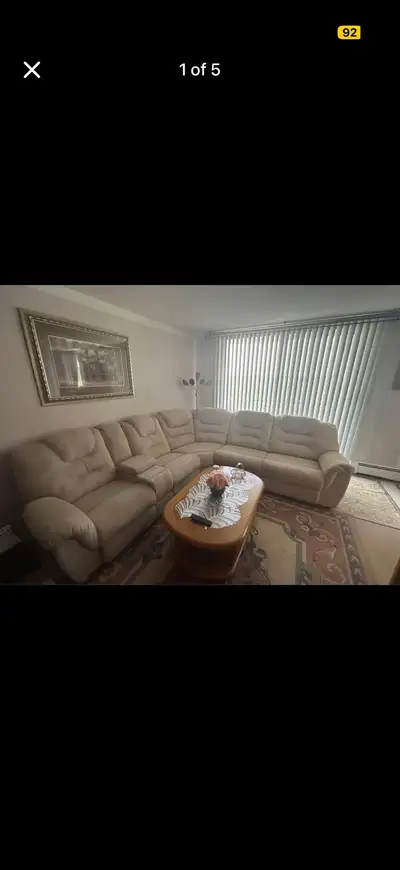 Indulge in the comfort of this beige/cream suede 5 seater reclining sectional, perfect for lounging...