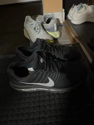 These are a pair of used Nike Air Max running shoes in men's size 11, perfect for hitting the paveme...