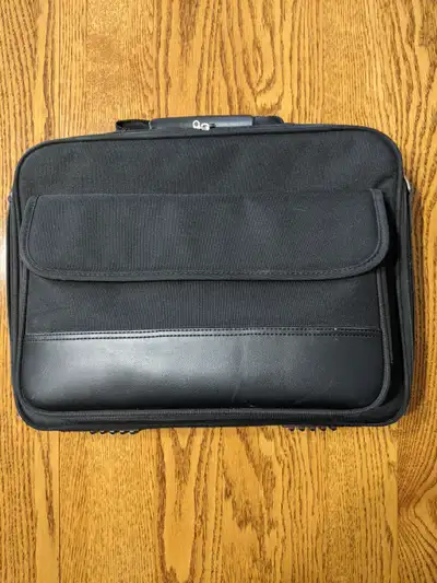 - 15" wide x 11" high x 2"deep - heavy duty carrying case with handles - the front has a pouch and s...