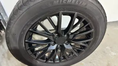 Selling a complete set of 4 Michelin X-Ice Snow winter tires mounted on 17-inch gloss-black alloy ri...