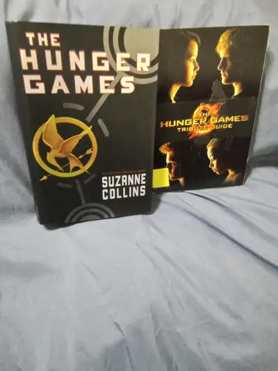 1- THE HUNGER GAMES (hardcover) 2-THE HUNGER GAME TRIBUTE GUIDE.(softcover) $2.00 EACH.