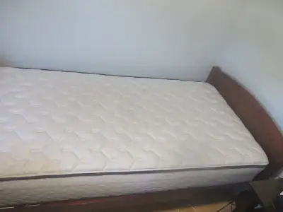 ON HOLD Free wood bed frame and Sealy mattress, View more