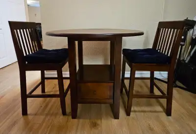 Tall solid hard wood ROUND TABLE with two  tall chairs, View more