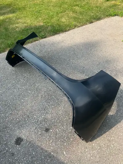 Brand new unpainted OEM 2025 Tesla Model Y Rear Bumper without diffuser