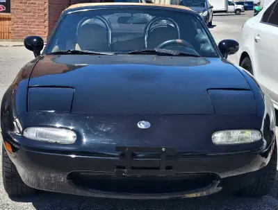 Selling my 1991 Mazda Miata convertible roadster, a classic beauty that's ready for some top-down fu...