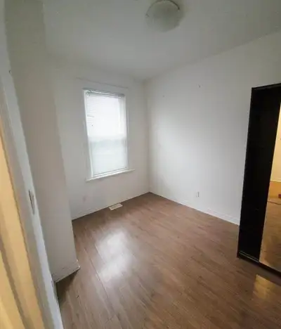Unfurnished room in a rent-controlled two-bedroom apartment in Chinatown. The room has a large windo...