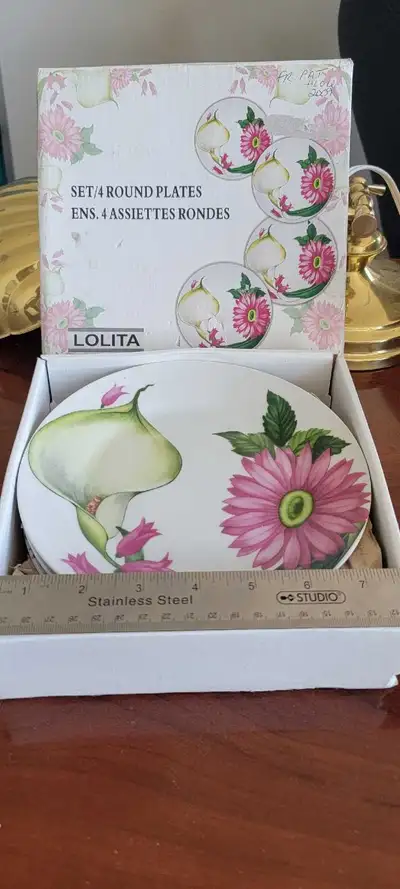 Round plates, set of 4. New condition never used. , View more