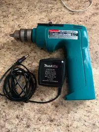 Makita 6040D 3/8 cordless drill with charger.