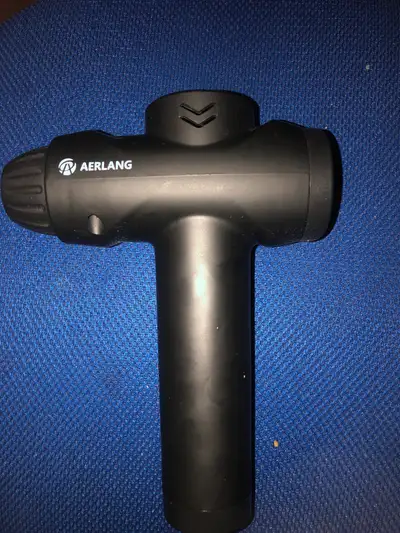 This is an Aerlang massage gun for muscle relaxation and therapy. It's in used condition but still w...