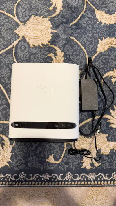 This Bell Giga Internet Hub is a modem and router combo. It's white and includes its power adapter....