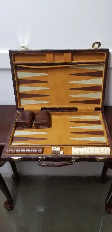 Brown leather backgammon case. Includes game pieces, dice and carrying case. Excellent for travel or...
