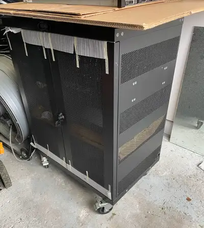Tripp Lite SmartRack Half-Height Server Rack Enclosure. Server enclosure is on wheels, half height a...