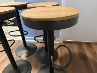 Like new set of 4 Adjustable Height Swivel Barstools, View more