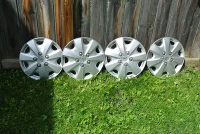 A set of 4 Toyota hubcaps in excellent condition. There is one that needs to be glued, as shown in t...