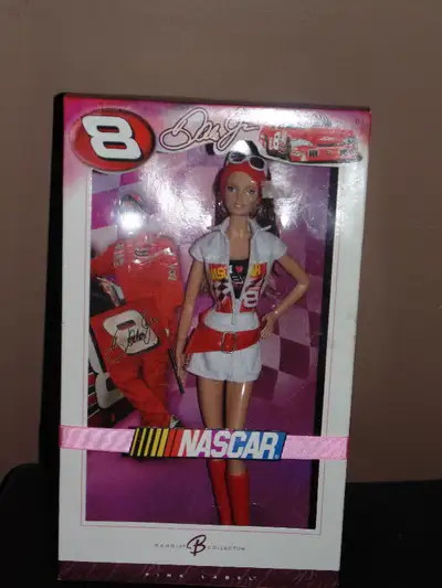 In the box Nascar Barbie Dale Jr. Includes all accessories, doll stand, Collector's card, Certificat...