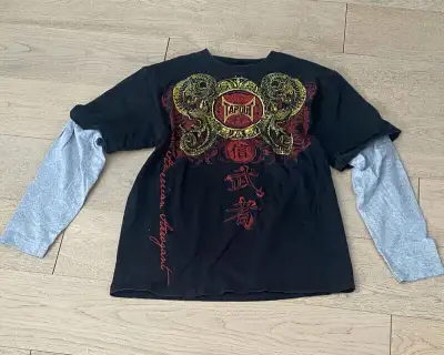 Here is your chance to own a vintage collection of TAPOUT T-Shirt Training Wear! These were taken ou...