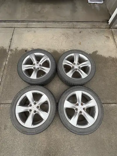 I am selling a set of four used winter tires and alloy rims, size 245/45R18, designed to fit a 2012...