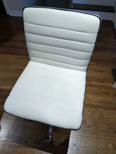 White Vinyl Low Back Designer Armless Ribbed Swivel Task Office, View more