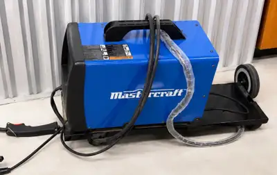Mastercraft MIG/Flux Core wire feed welder with rolling cart. Includes welding gun, ground cable, an...