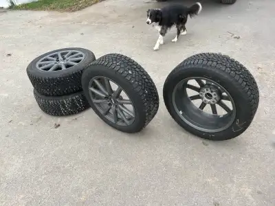 Studded tires used only 1 winter Still 90% tread left 215/55R 17. T98 XL Winter tires and rims for 2...