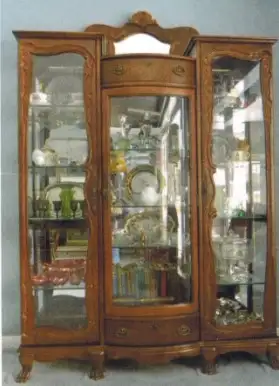 Oak China Cabinet by Pulaski: 56"W x 19"D x 83"H features carved backsplash with oak overlay ornamen...