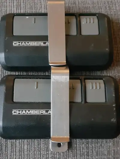 FREE-  Two Chamberlain garage door openers with new batteries., View more
