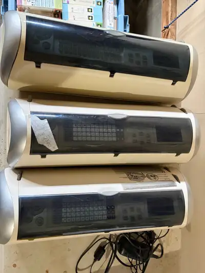 -3 expression Cricut machines for scapebooking -Cricut cutting pad -171 cartridges -1 plastic holder...