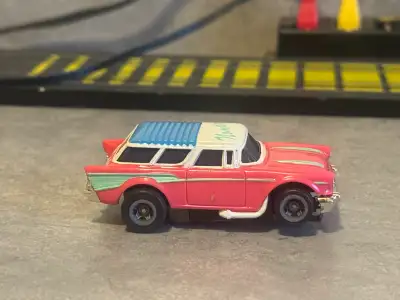 Brand New TOMY TURBO AFX 57’ CHEVY NOMAD-PINK/WHITE BLISTER PACK GLUE HOLDING PLASTIC CASE DRIED OUT...