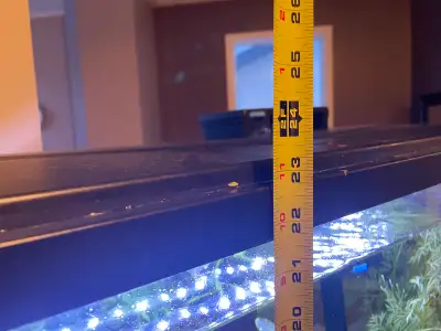 50 gallon fish aquarium with accessories. Fish included. 12 inches deep, 30 inches wide, 22 inches t...