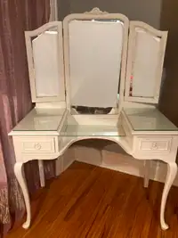 antique wood vanity with tri-fold mirror