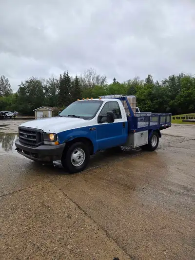 F350 flatbed work truck 420,000 km 5.4 V8 had coils and spark plugs put in new last year. Truck fire...