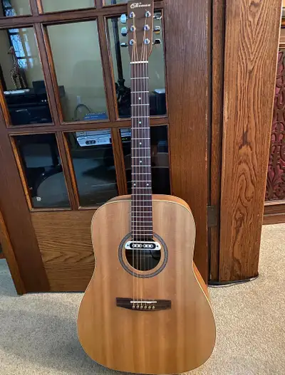 The Norman B20-6 is a Canadian-made dreadnought acoustic guitar featuring a Solid Sitka Spruce top a...