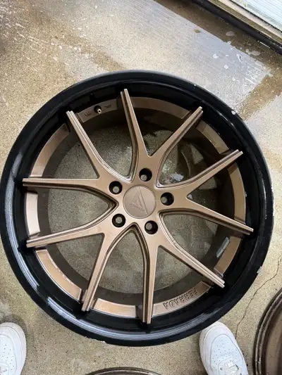 20x9 5x120 +35 bronze with black lip 4 rims two rims are including the pictures to showcase the wear...