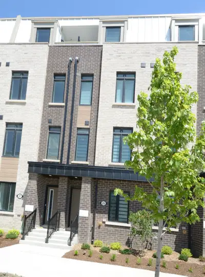 Modern townhouse. 4 bedrooms plus den, 3.5 baths, private garage with remote and direct access into...