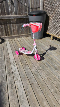Small girls scooter and picnic table