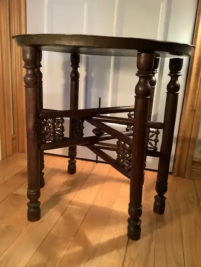 Large antique hand carved hand crafted mahogany wood Indian table with gateway carved legs and an em...